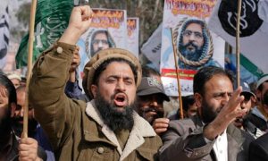 Supporters in in Muzaffarabad, capital of Pakistan-administrated Kashmir, of various political religious parties, take part in a demonstration to condemn the hanging of Mohammad Afzal Guru. Photograph: Amiruddin Mughal/Reuters